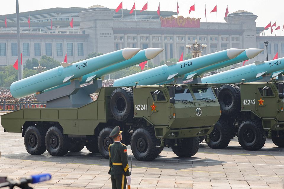 A member of the People's Liberation Army stands as the maritime operations group displays YJ-20 hypersonic anti-ship missiles in Beijing, China. Photo: Reuters